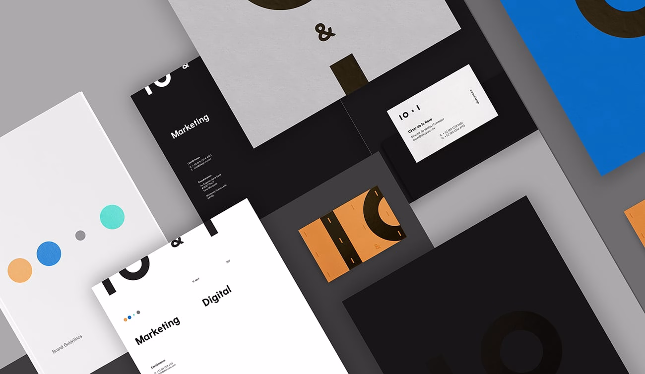 A collection of sleek marketing materials in black, white, and orange, featuring geometric designs and varied typography.