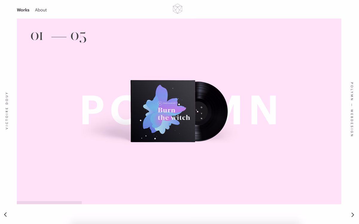 A black vinyl record beside its cover on a soft pink background, featuring abstract floral artwork and bold typography.
