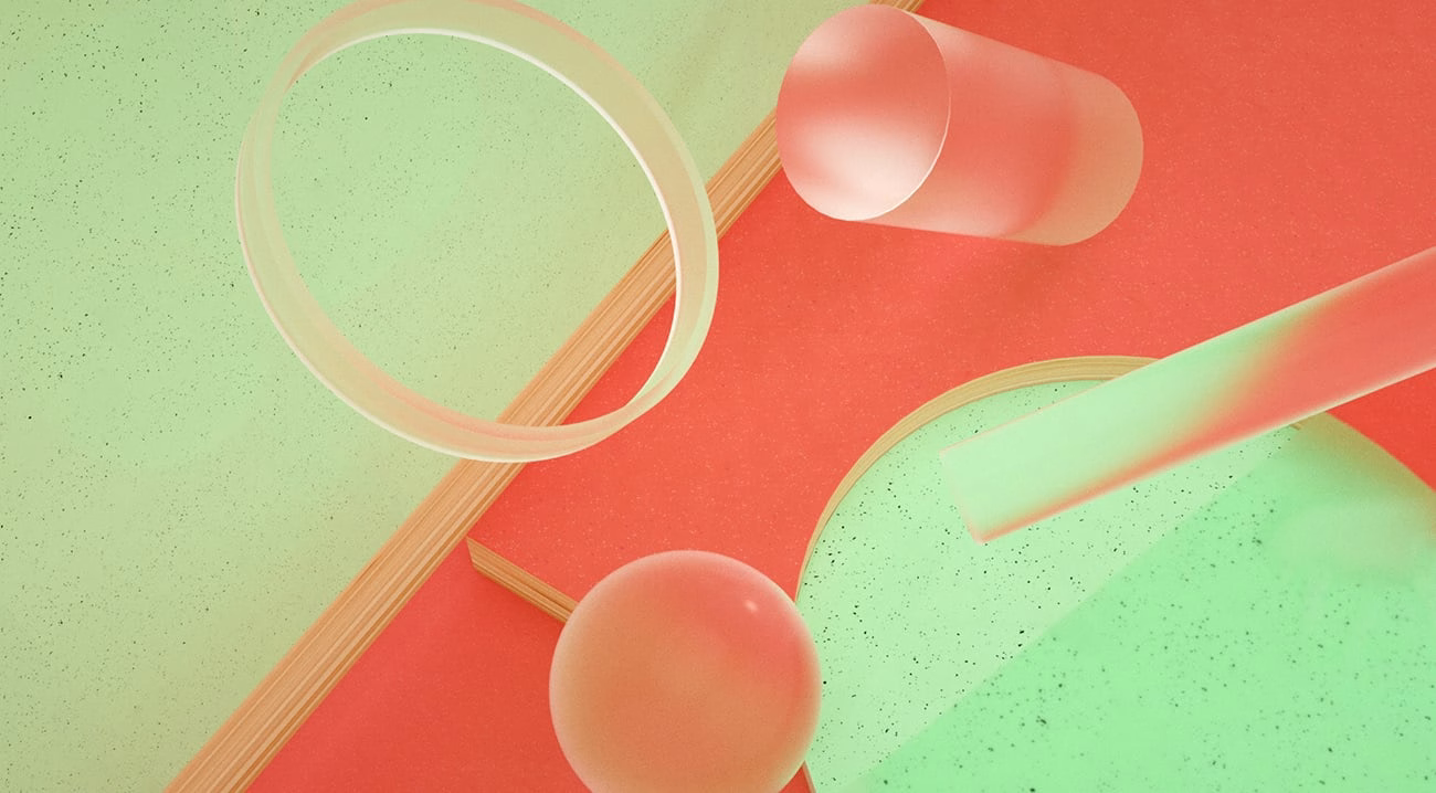 Abstract arrangement of translucent shapes in pink and green on a textured surface, creating a playful visual composition.