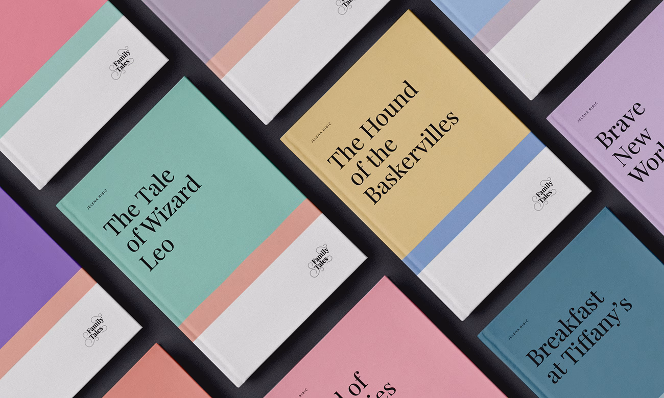 A flat lay of several books with colorful covers, featuring clean typography in black and pastel hues.