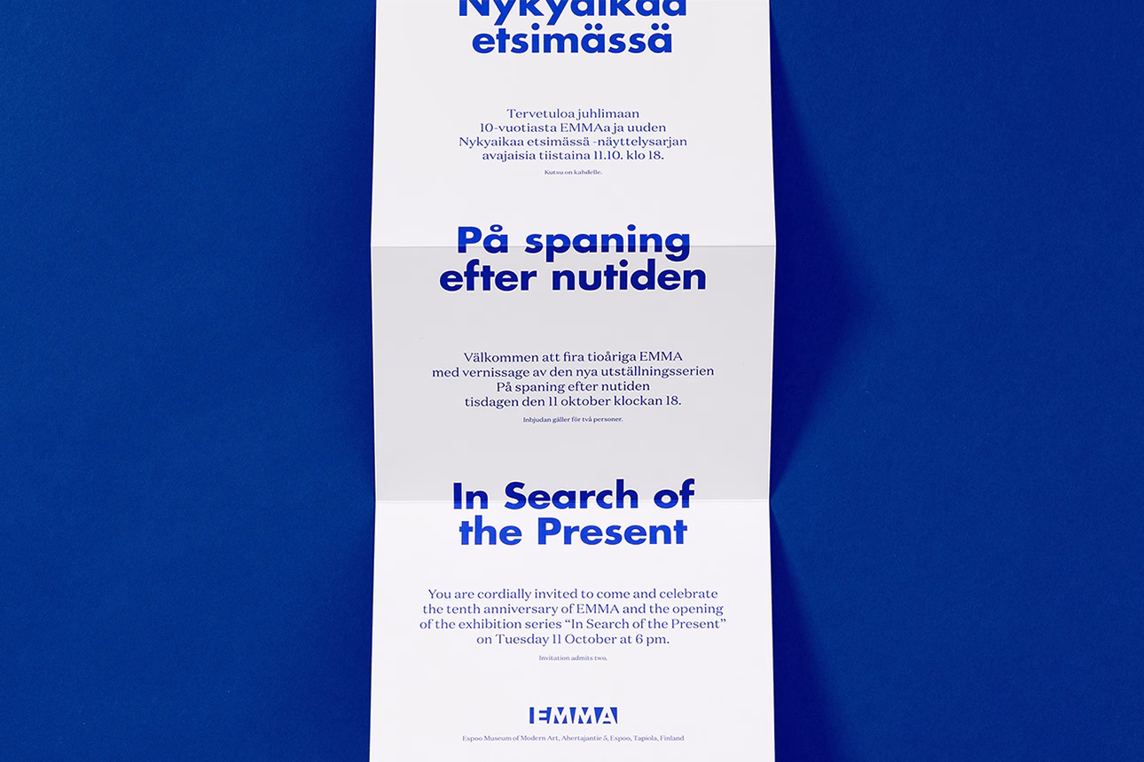 A tri-fold invitation printed on white paper, featuring bold blue typography against a deep blue background.