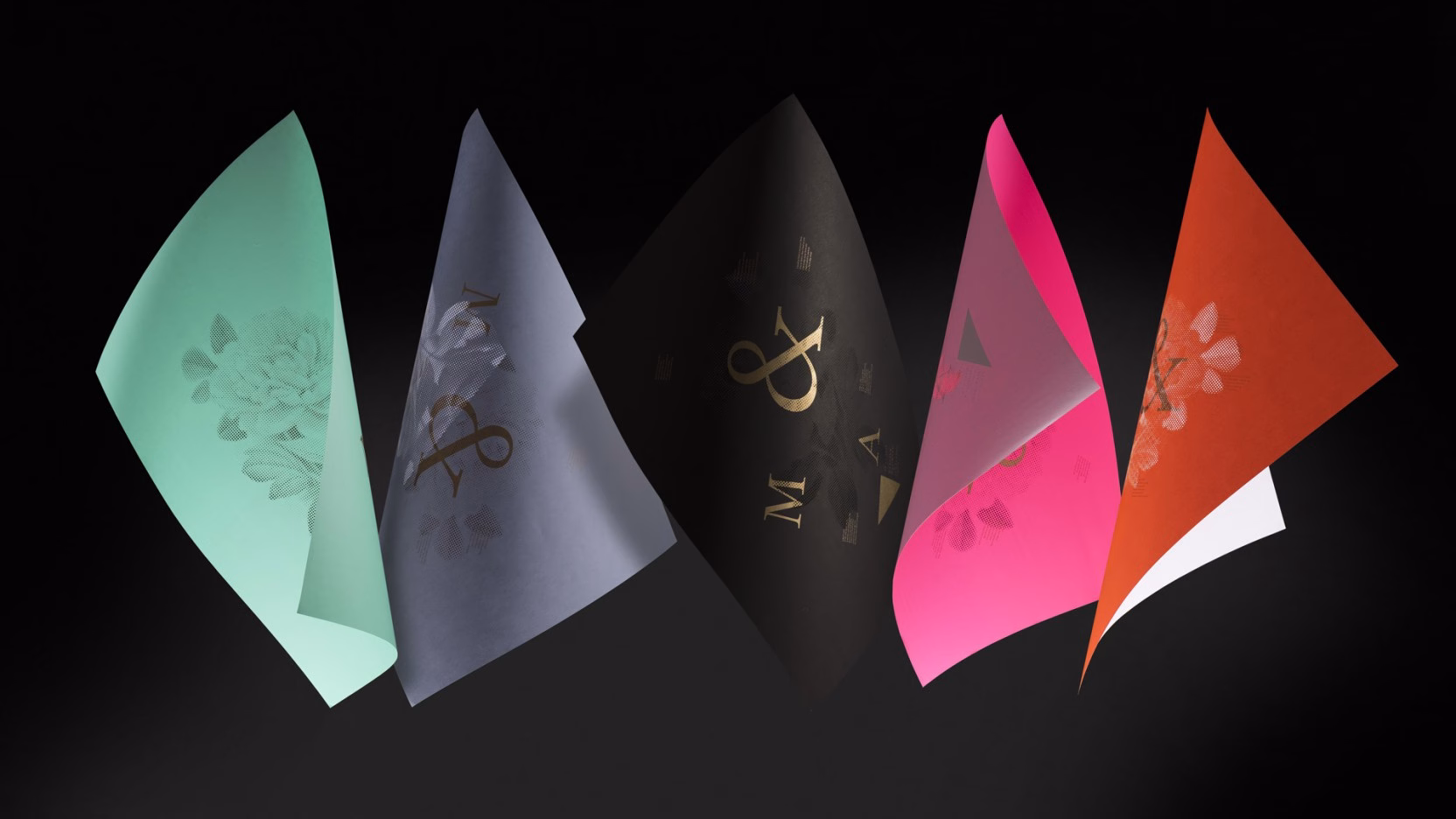 Five colorful sheets of paper in varying shapes and sizes, featuring floral patterns and typography, against a dark background.
