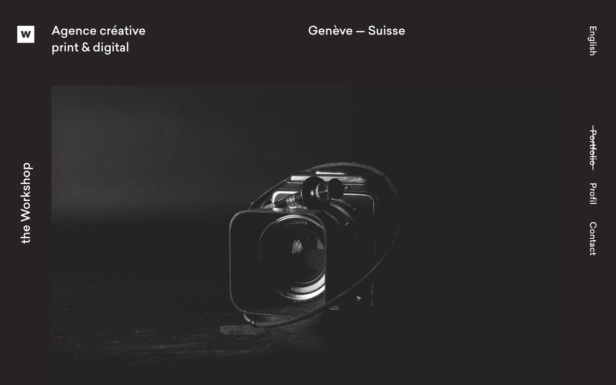 A vintage camera with a sleek black design sits against a dark backdrop, exuding a sense of nostalgia and artistry.
