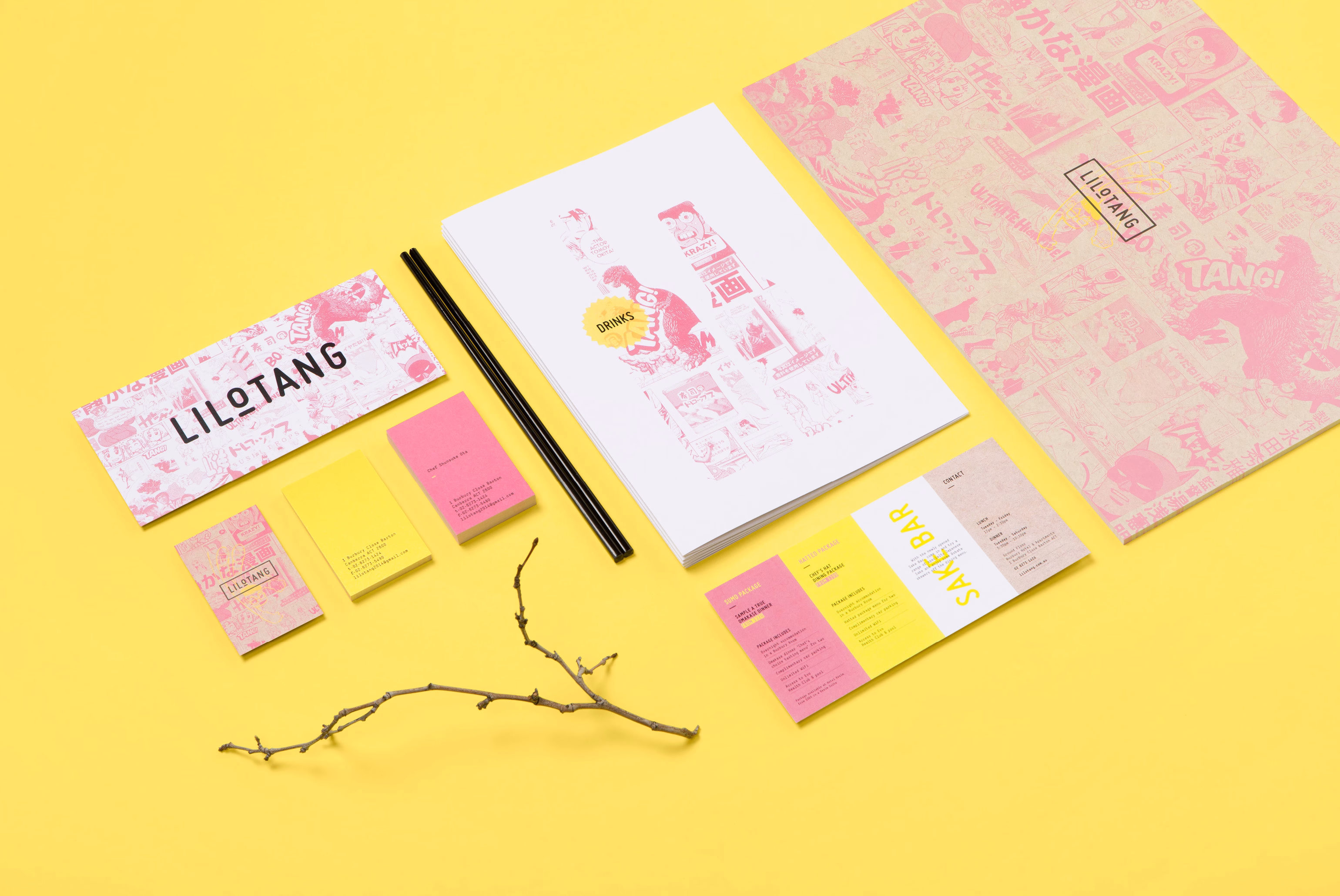 A collection of branding materials including pink and yellow menus, a notebook, and chopsticks, arranged on a yellow background.