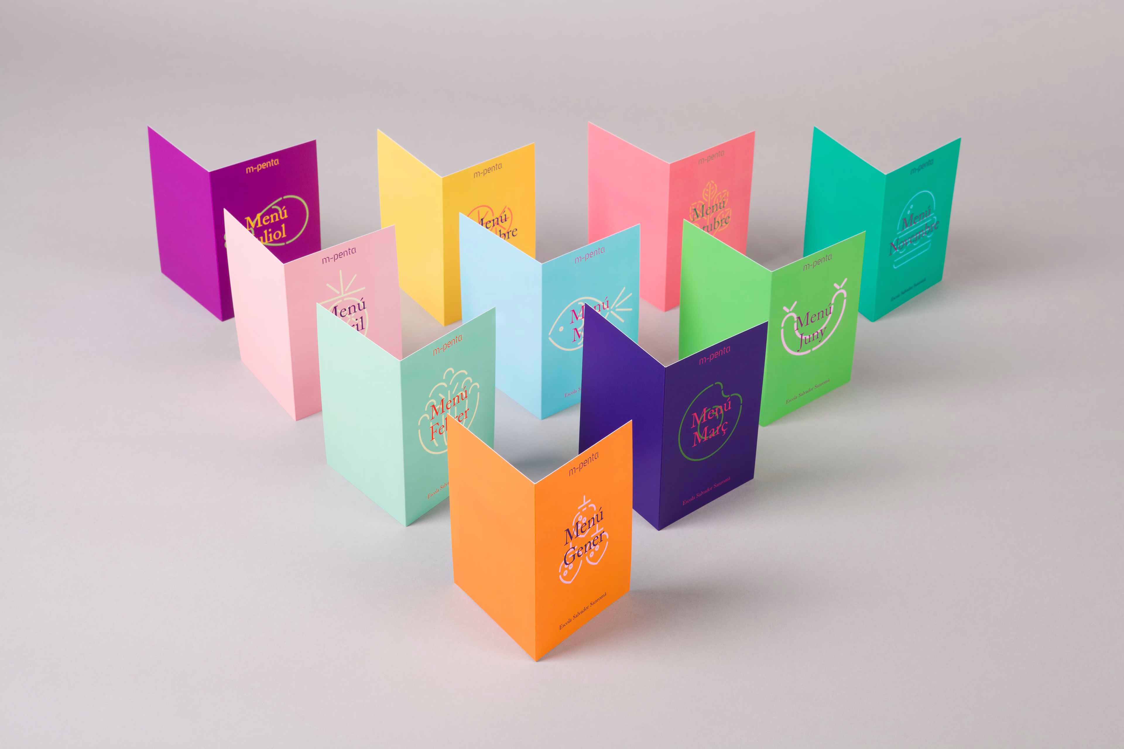 A series of colorful folded menus in pink, green, yellow, and purple arranged on a light gray background.