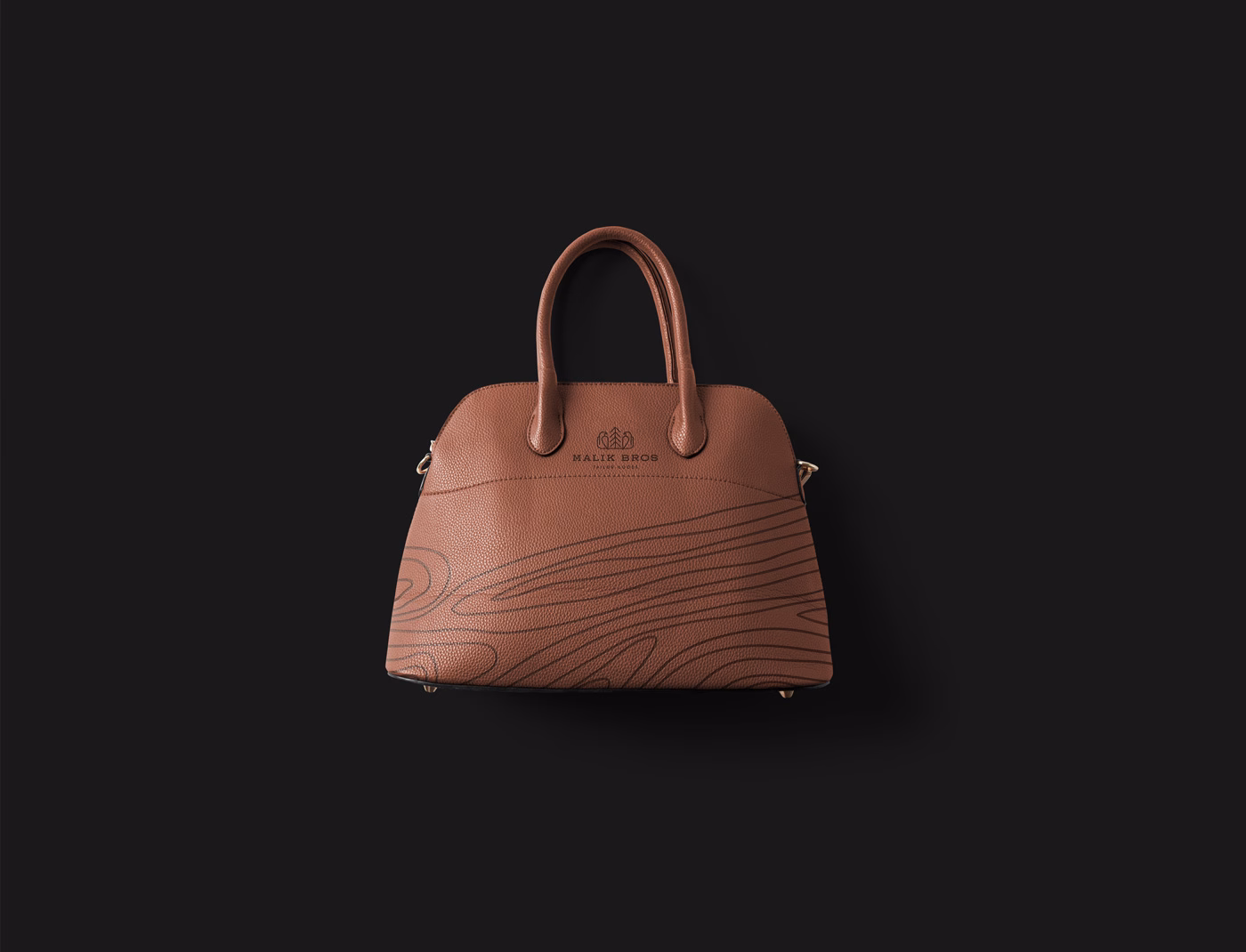 A brown leather handbag with a textured surface and subtle swirl designs, set against a black background.