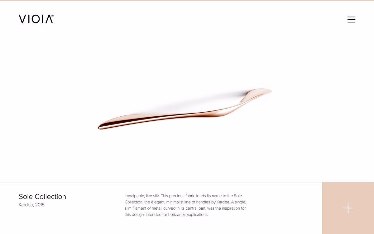 A sleek, curved rose gold handle from the Soie Collection rests against a minimal white background.