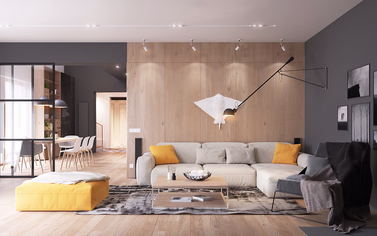 A bright living room featuring a gray sofa, wooden accent wall, and a textured yellow ottoman.