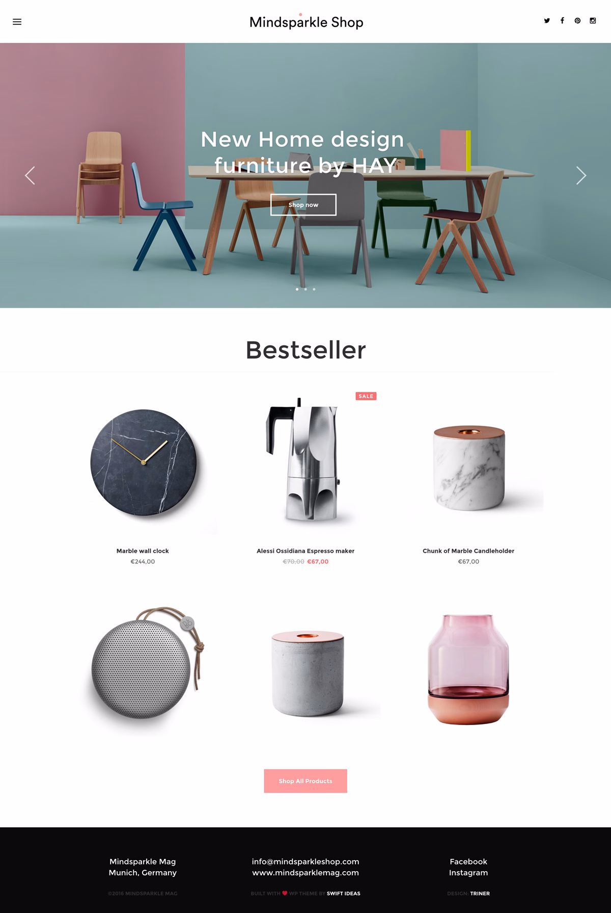 A stylish furniture showcase features a wooden table and colorful chairs against pastel walls in a vibrant display.