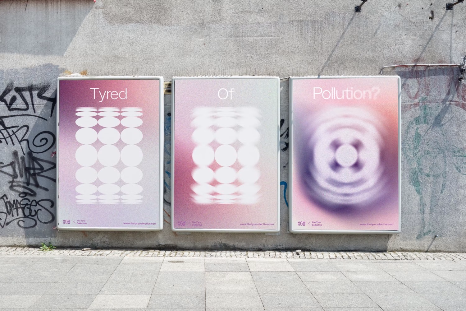 Three abstract posters with soft gradients in pink and purple display the words "Tyred," "Of," and "Pollution?" on a city wall.