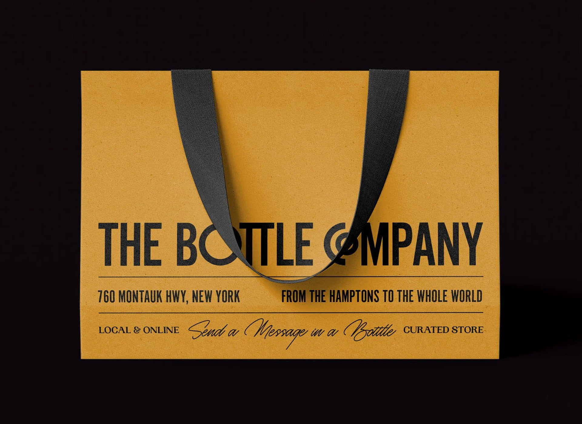 A kraft paper bag with "THE BOTTLE COMPANY" and location details on the front.