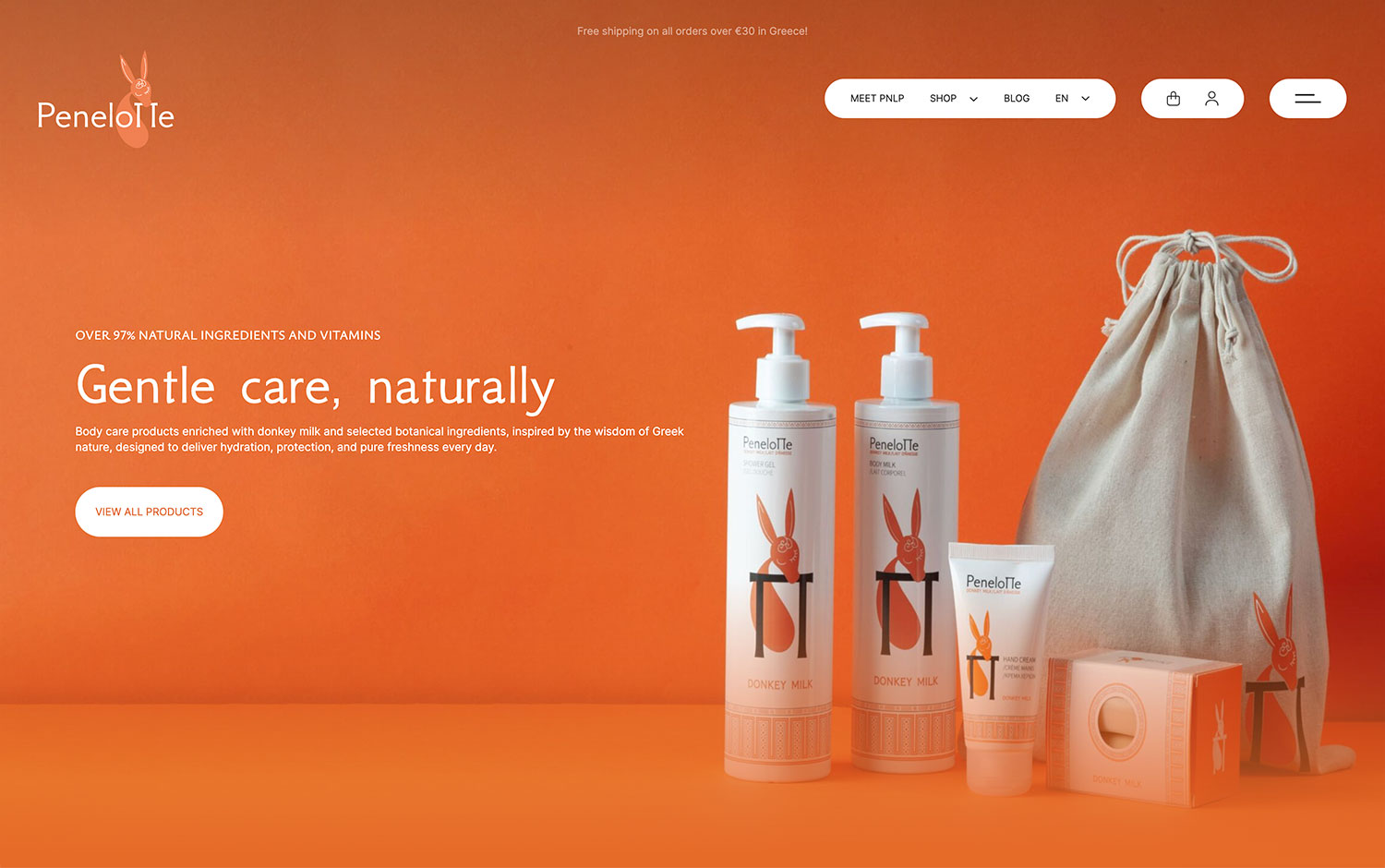 Natural body care products with donkey milk on an orange background.