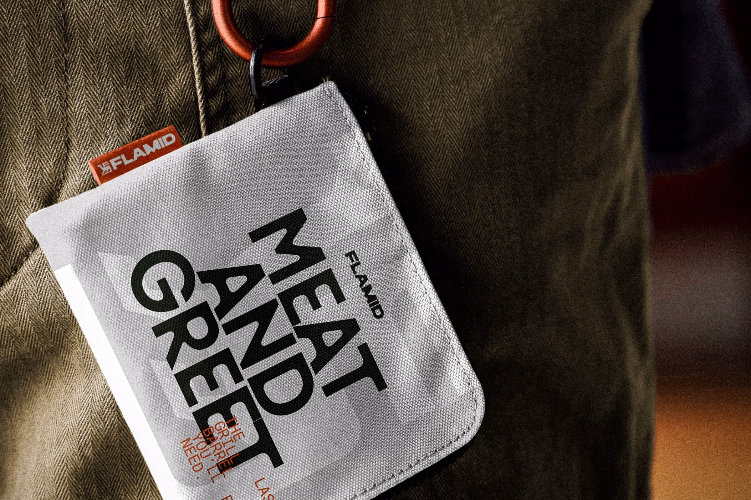 Flamid brand packaging features bold black typography on a textured white background, attached to a fabric pocket.