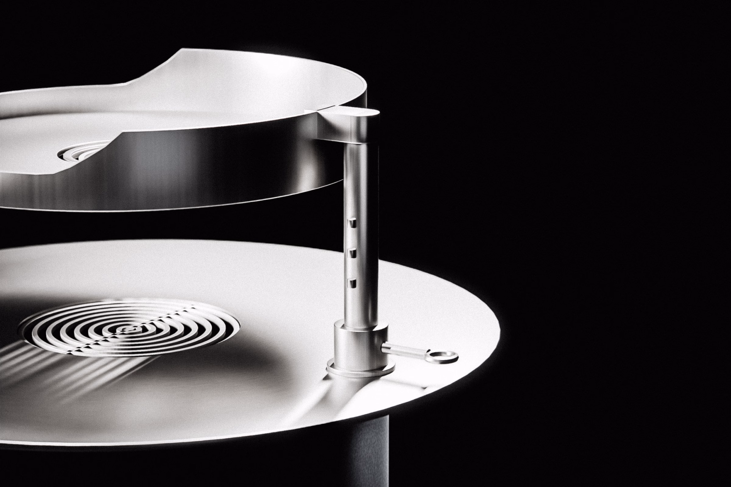 Close-up of a steel grill featuring a circular design with a bird-in-the-F symbol, highlighting industrial elegance.