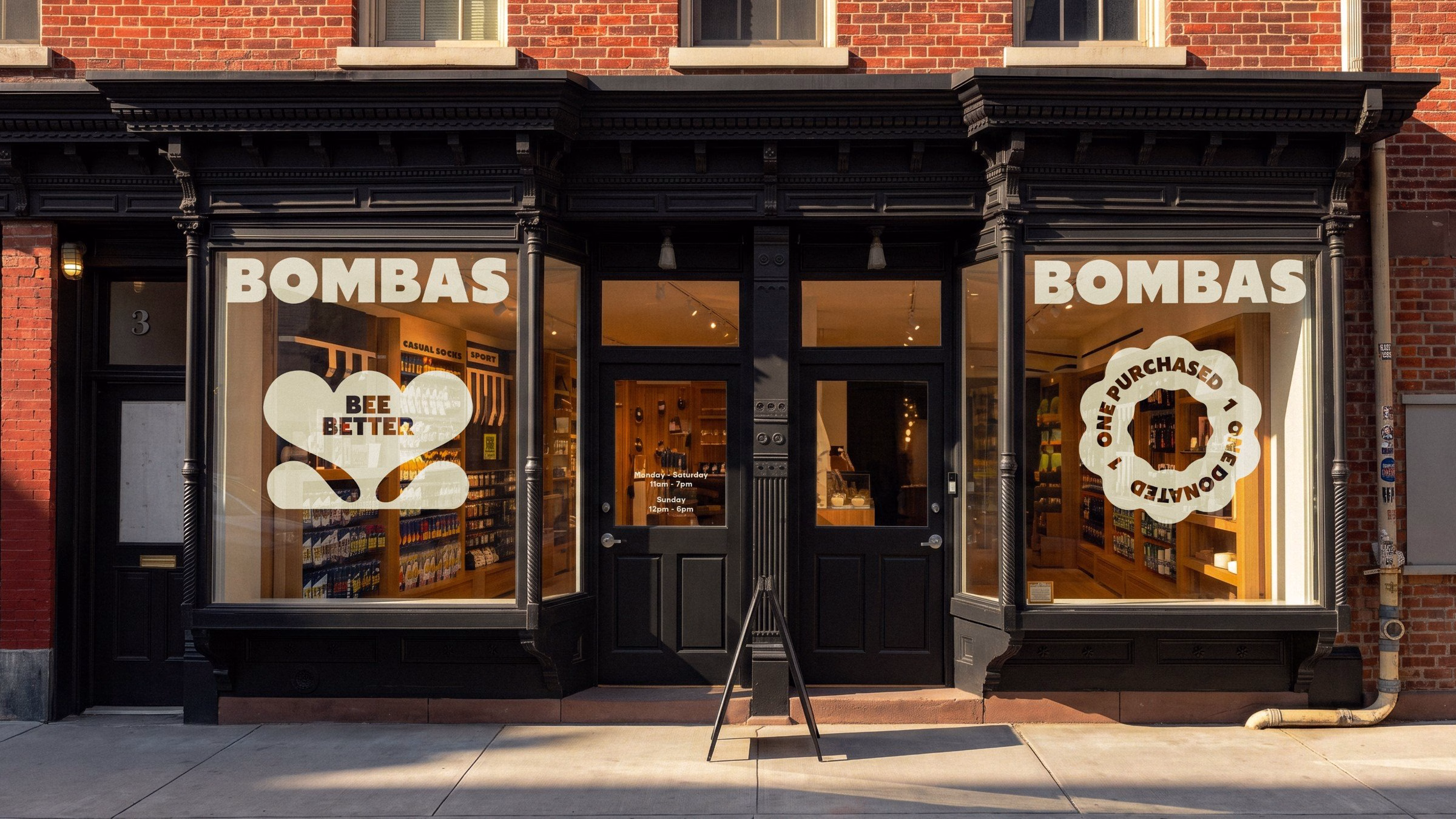 Bombas storefront featuring rounded typography and pastel window graphics on a brick building background.
