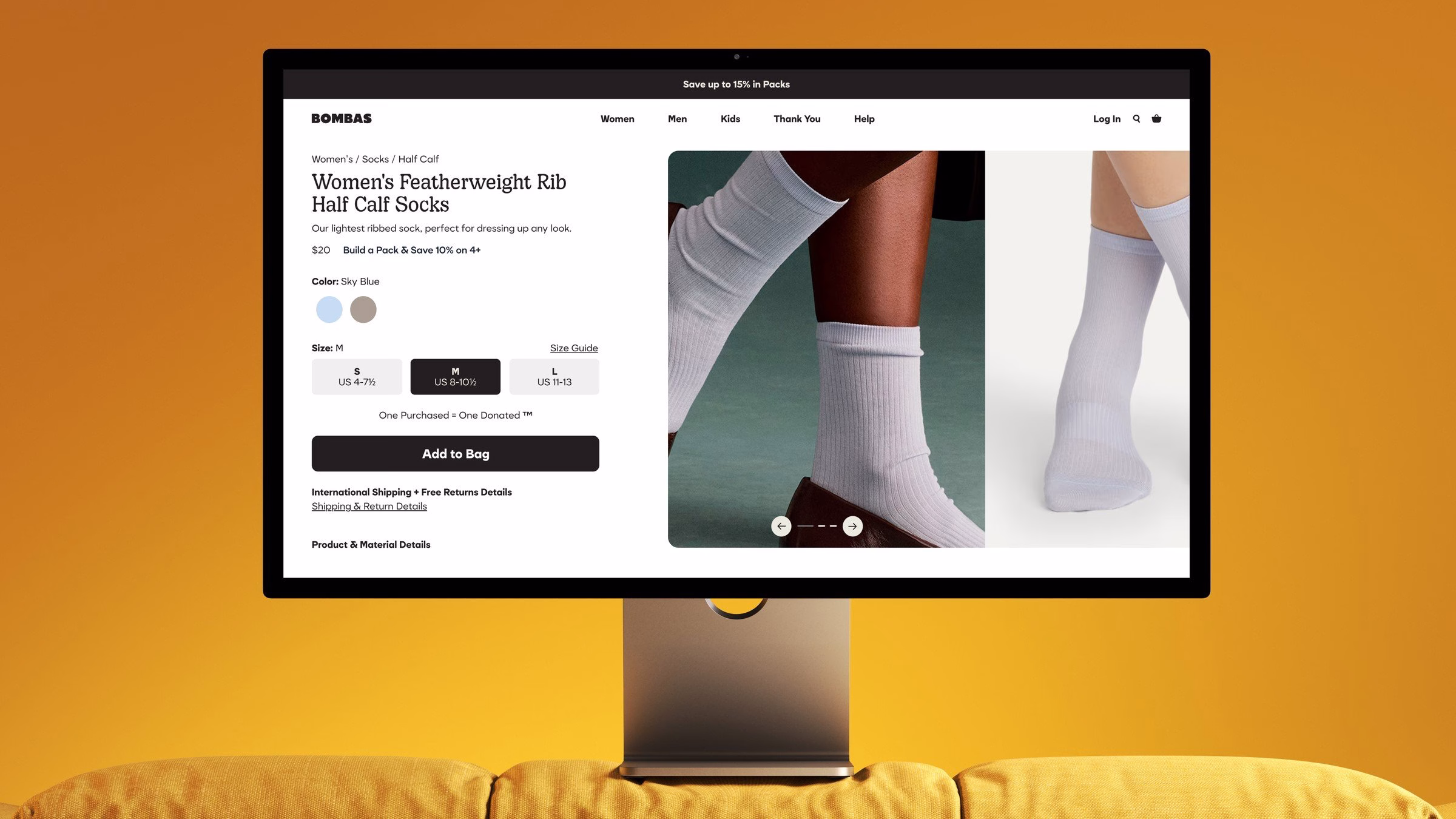 Product page design for Bombas featuring light grey women's socks and rounded typography on a warm orange backdrop.