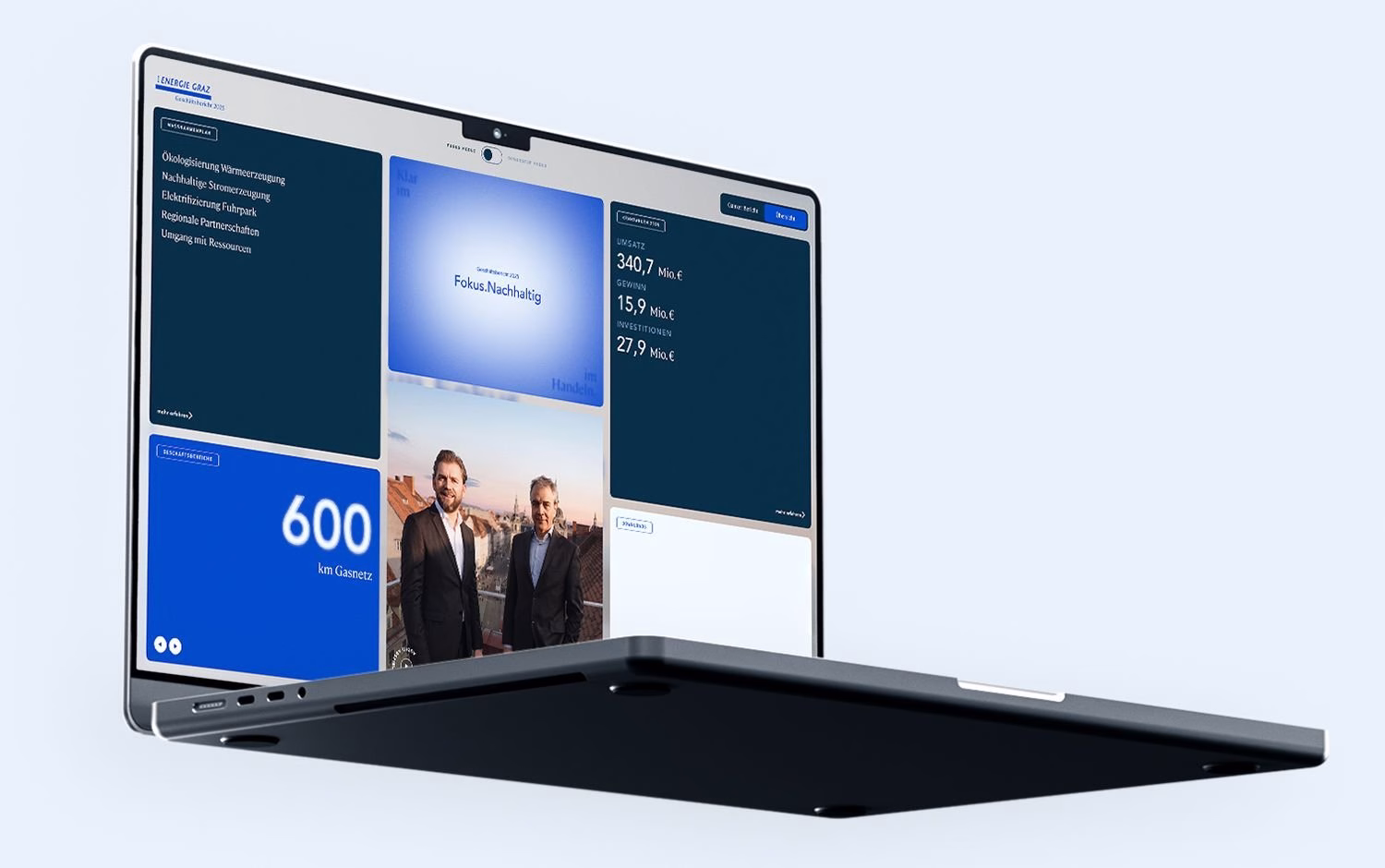 Energie Graz annual report website on a laptop with key figures, sustainability cards and leadership portrait