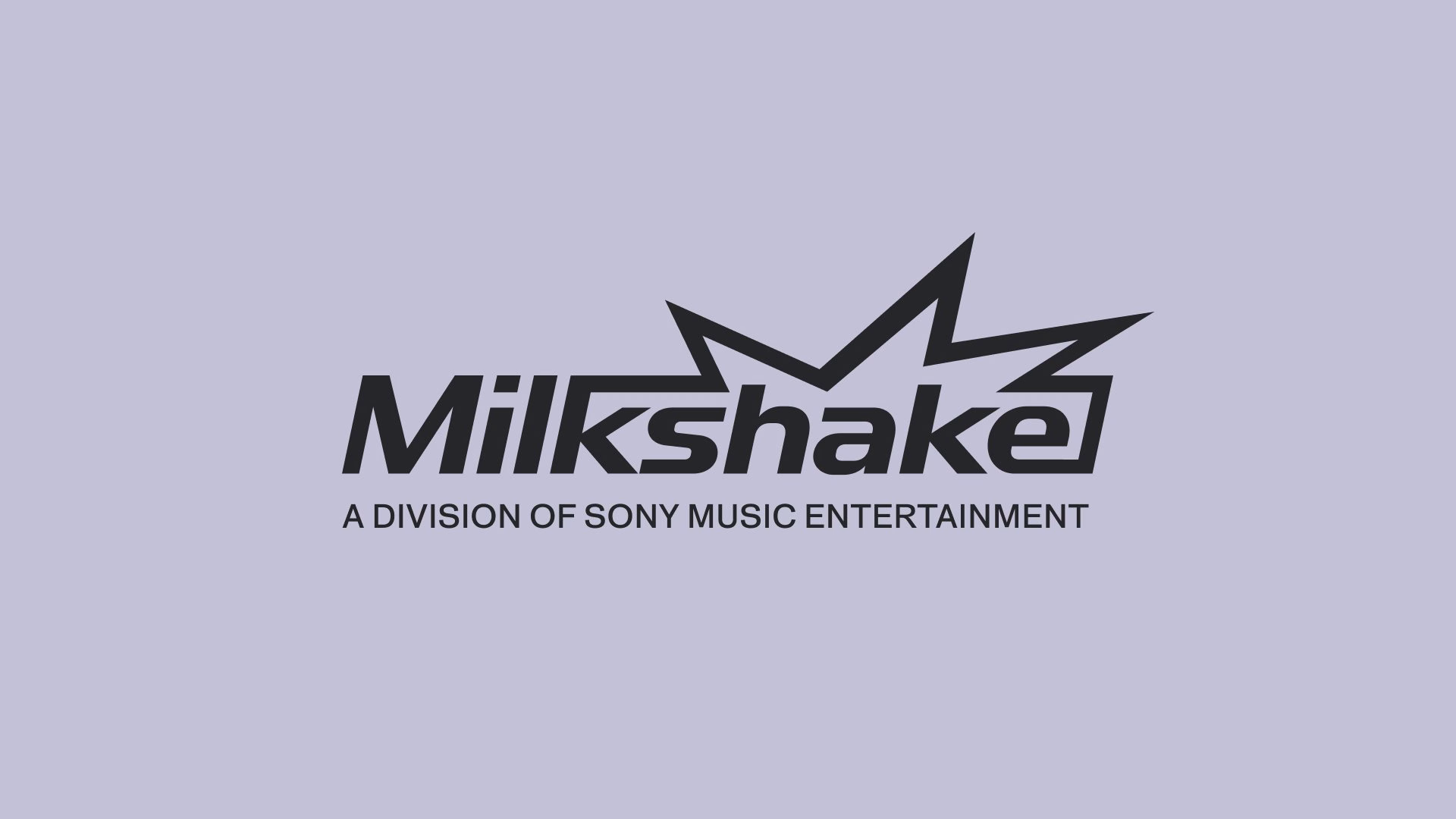 Milkshake logo featuring a bold black typographic design with angular elements against a pastel purple background.