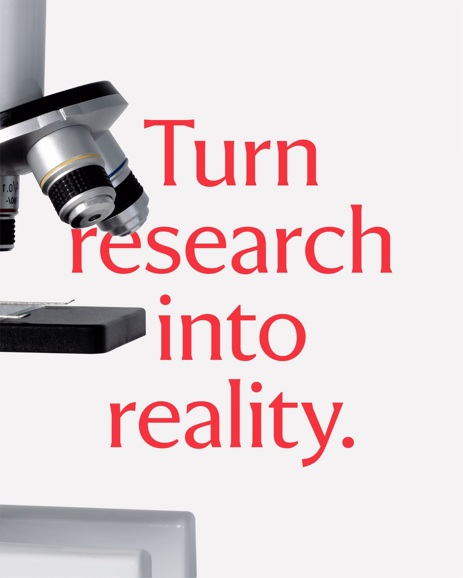 A microscope with a black and silver eyepiece sits beside bold red text reading "Turn research into reality" against a white background.