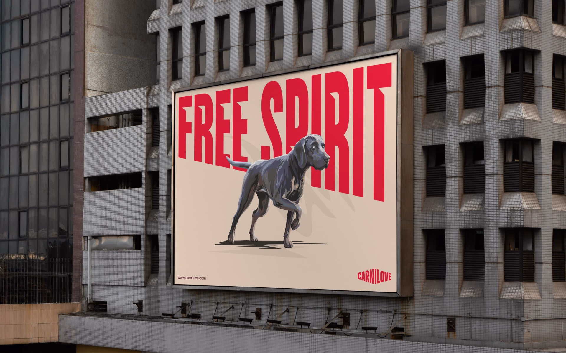 A billboard featuring a gray dog and bold red typography reading "FREE SPIRIT," promoting Carnilove pet food.