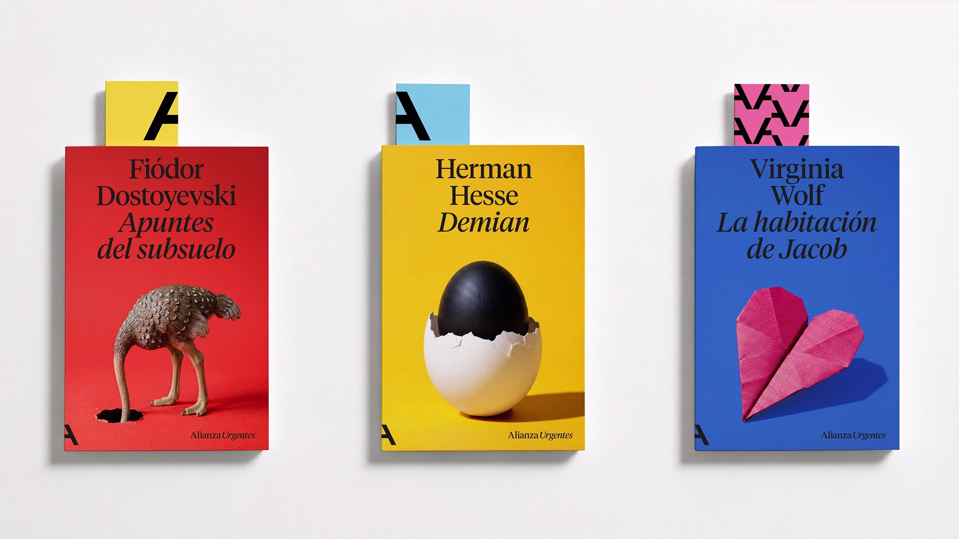 Three book covers feature bold colors: red, yellow, and blue, each showcasing unique illustrations and typographic styles.