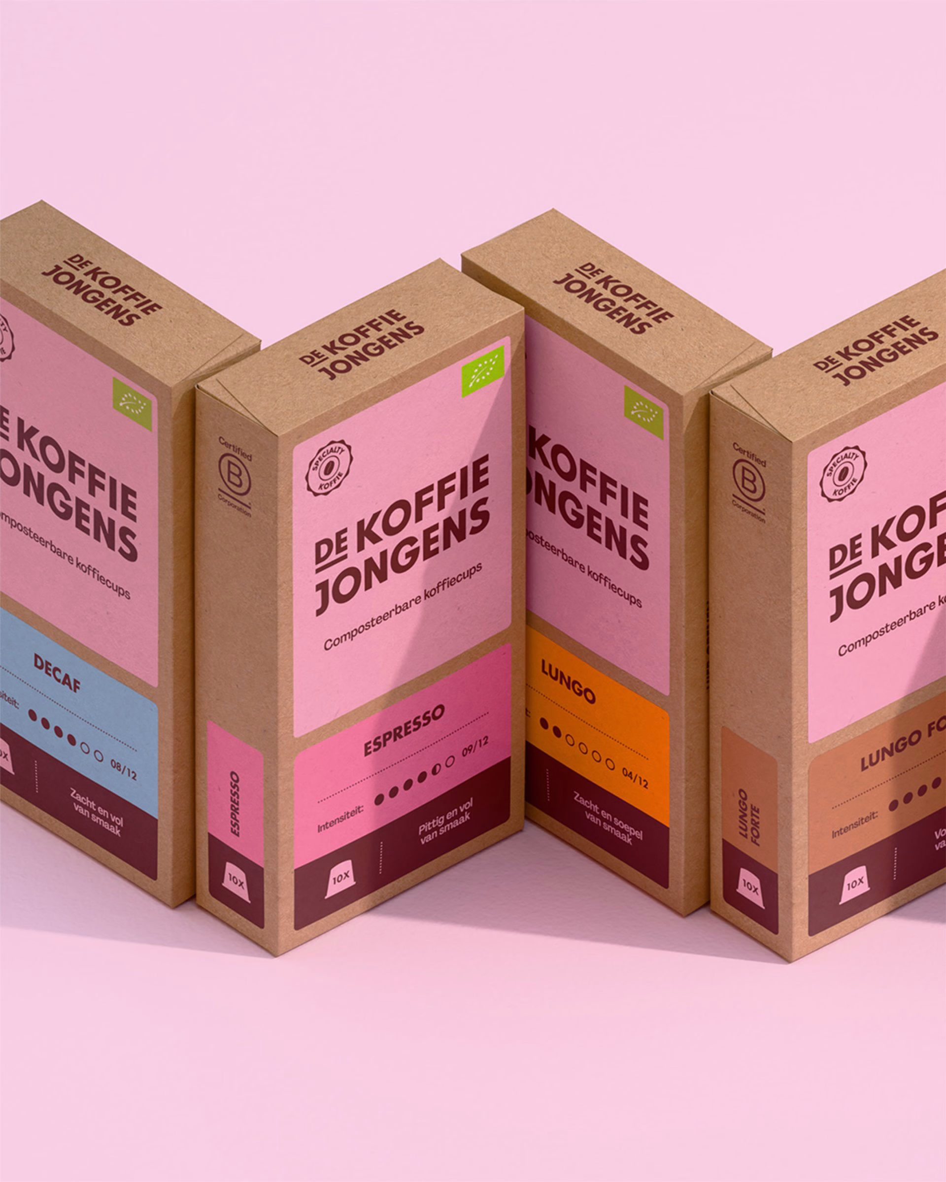 Four coffee packaging boxes for De Koffiejongens feature pink and brown color schemes and sustainable design elements.