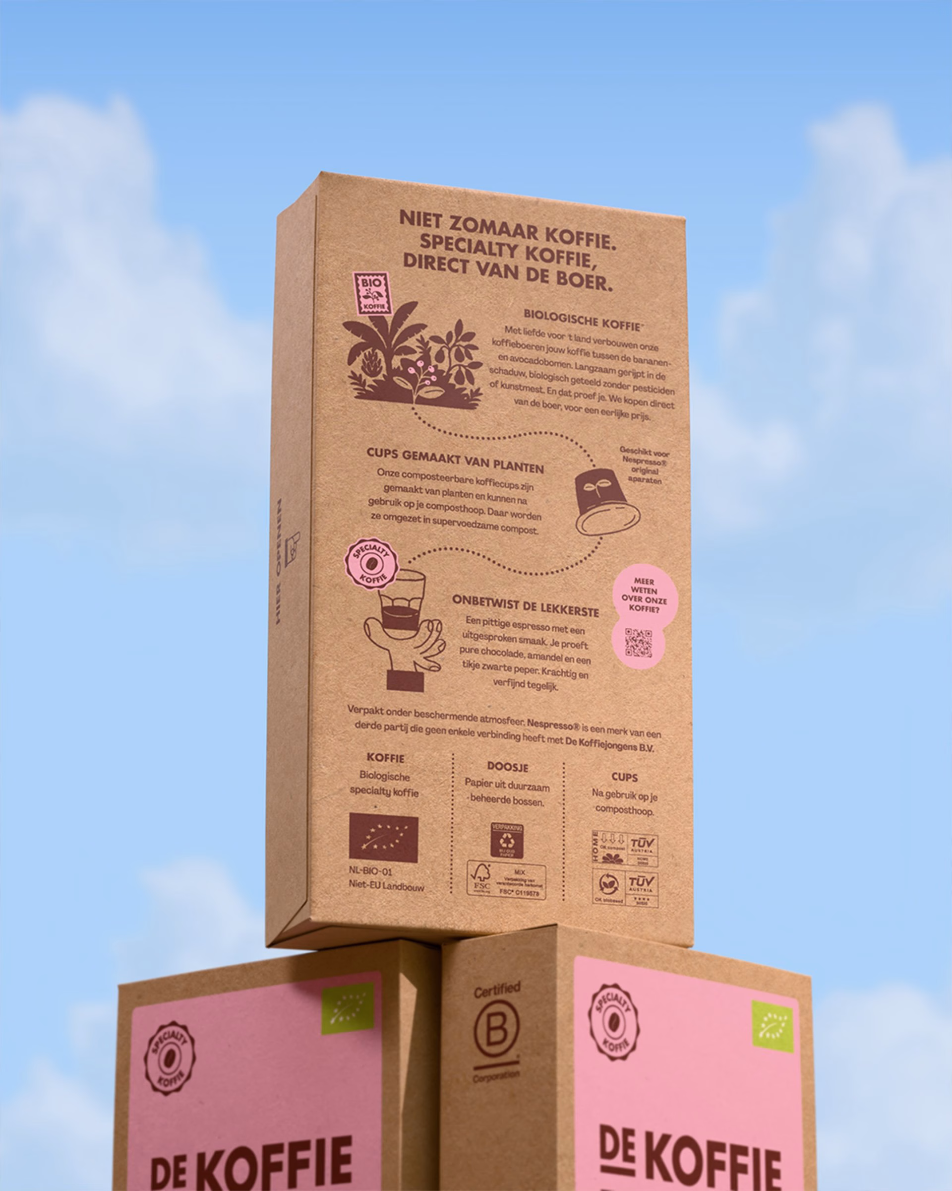 Brown cardboard coffee packaging with pink accents and illustrations, showcasing sustainable design by De Koffiejongens.