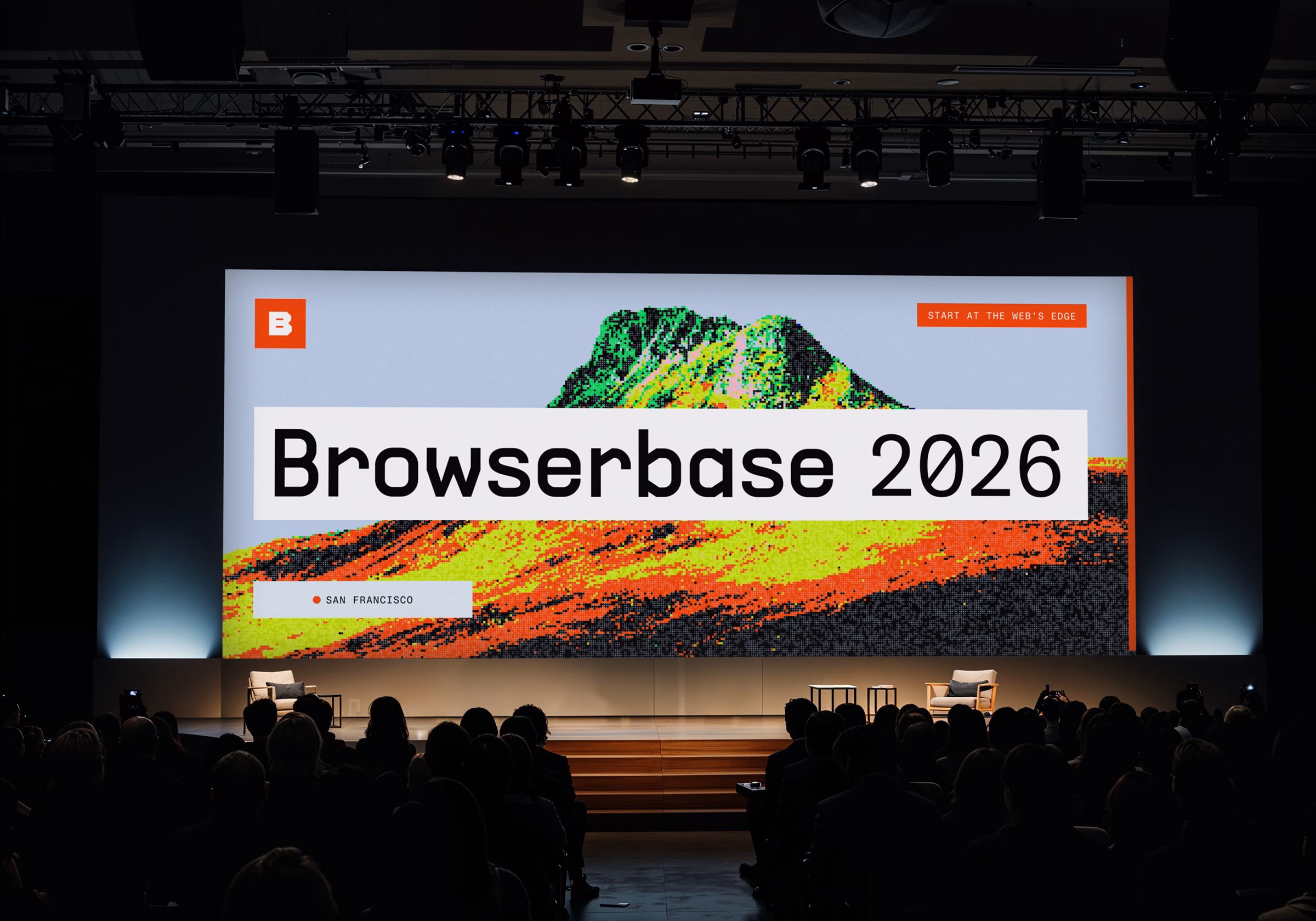 A large presentation screen displays "Browserbase 2026" in bold typography with a vibrant, pixelated mountain backdrop.
