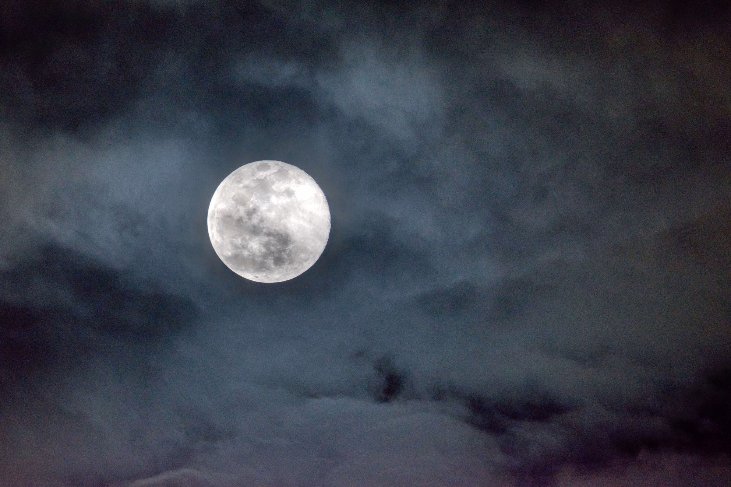 Full moon in a cloudy night sky, the reference for LA MAISON Moonlit Night mooncake packaging