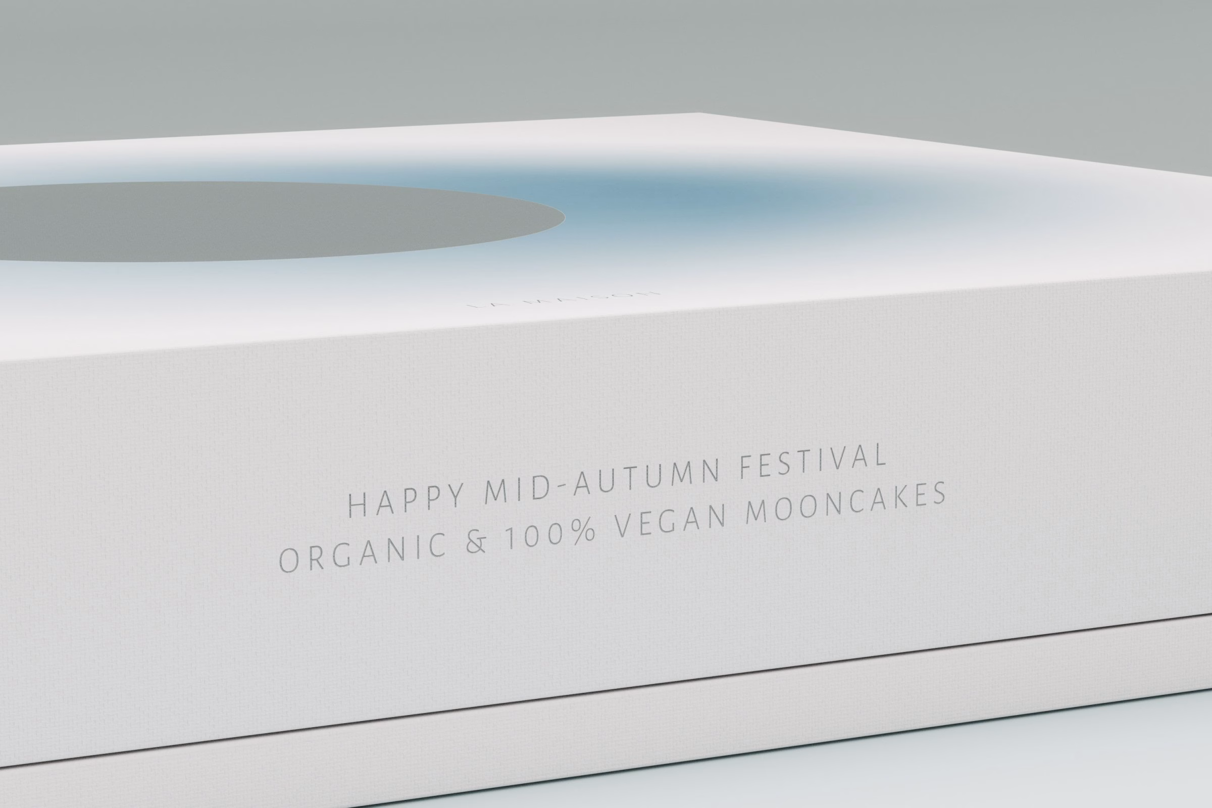 White mooncake box lid reading Happy Mid-Autumn Festival, organic and vegan mooncakes, LA MAISON