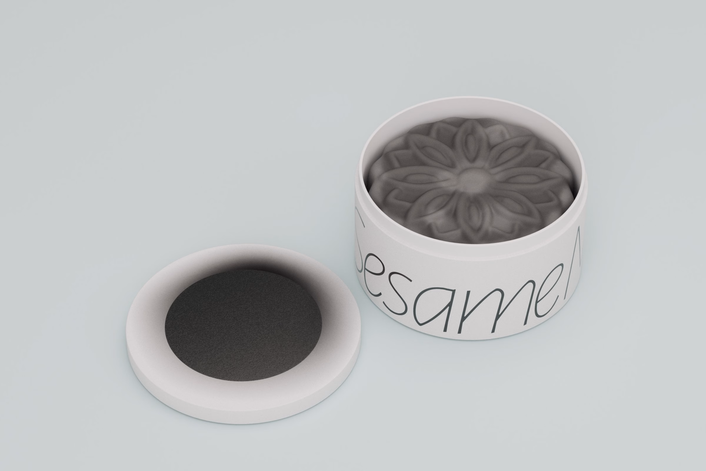 Charcoal sesame mooncake in an open white tin, LA MAISON packaging
