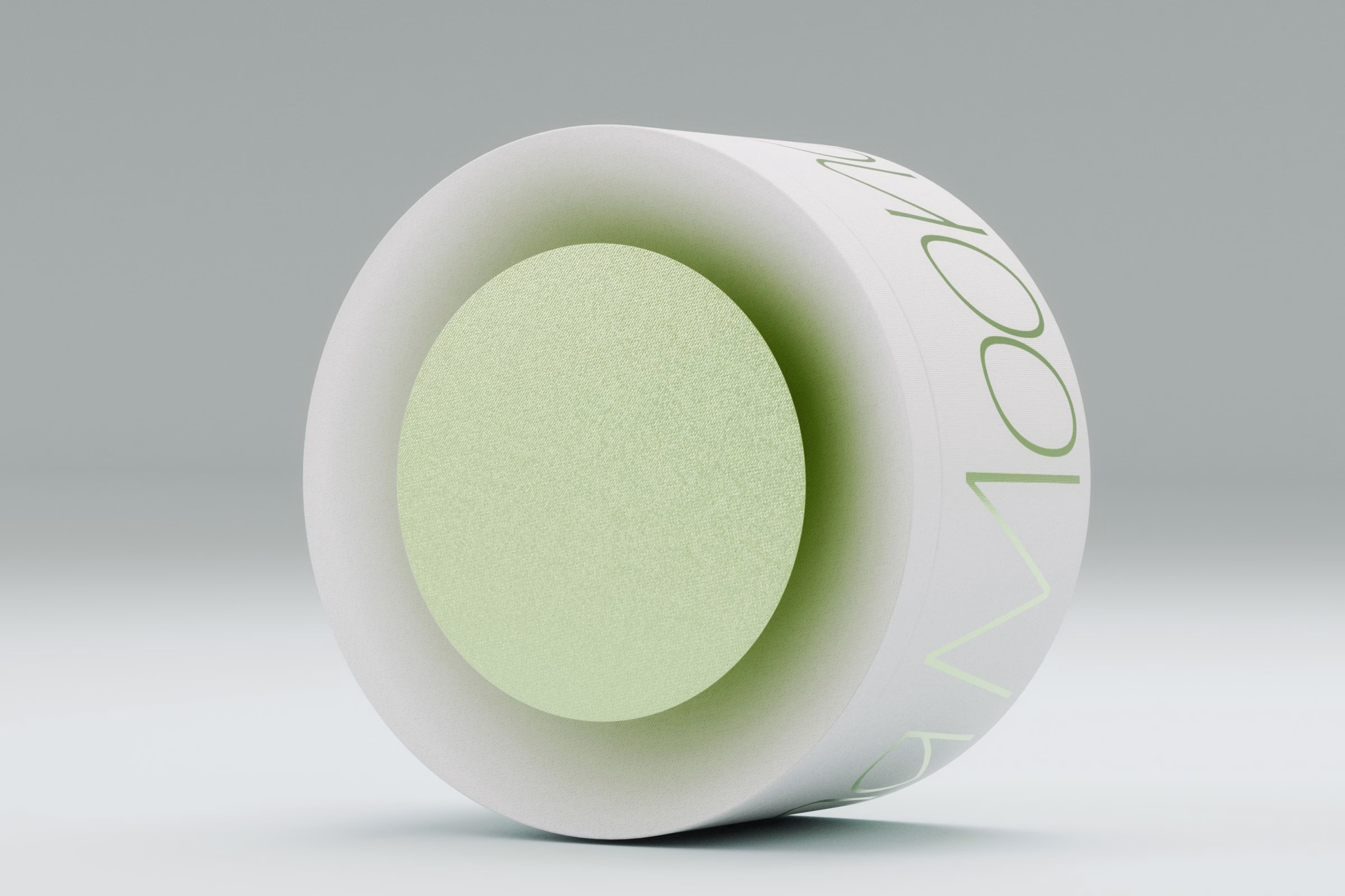 Single white mooncake tin tipped on its side showing a green inner base, LA MAISON packaging