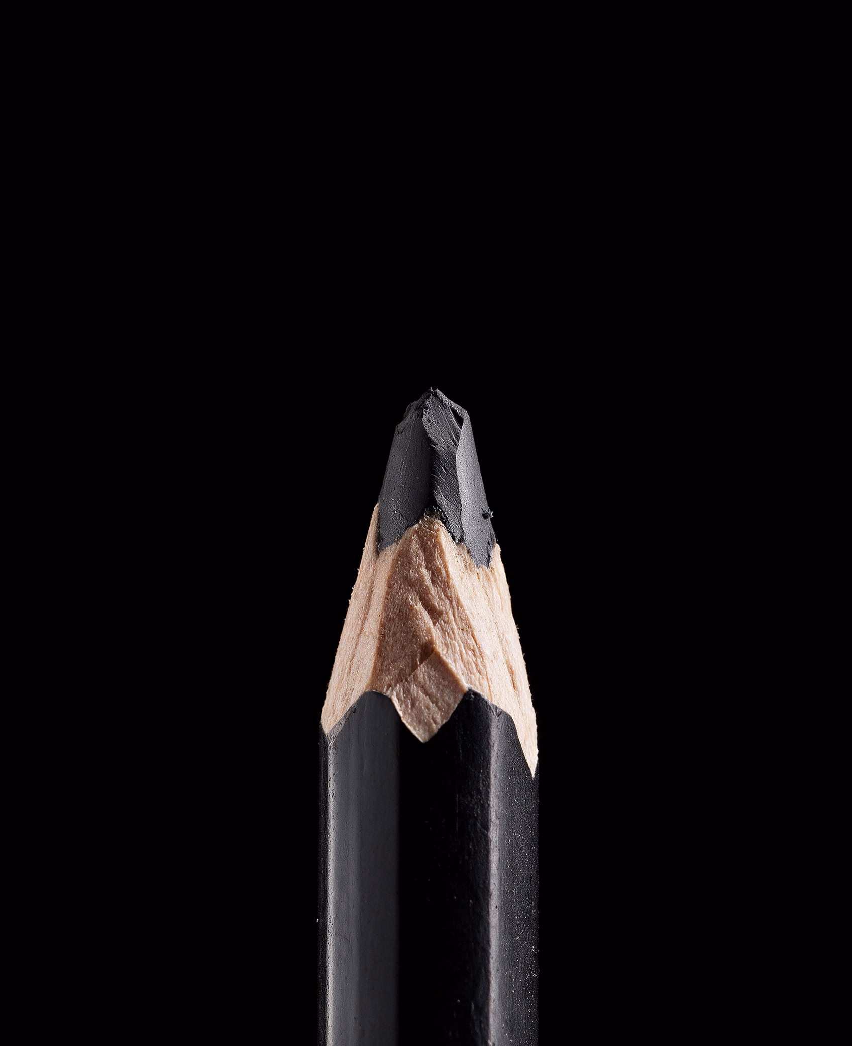 Sharpened black pencil on a black background, Black Paper print house brand identity by DOMINGO.