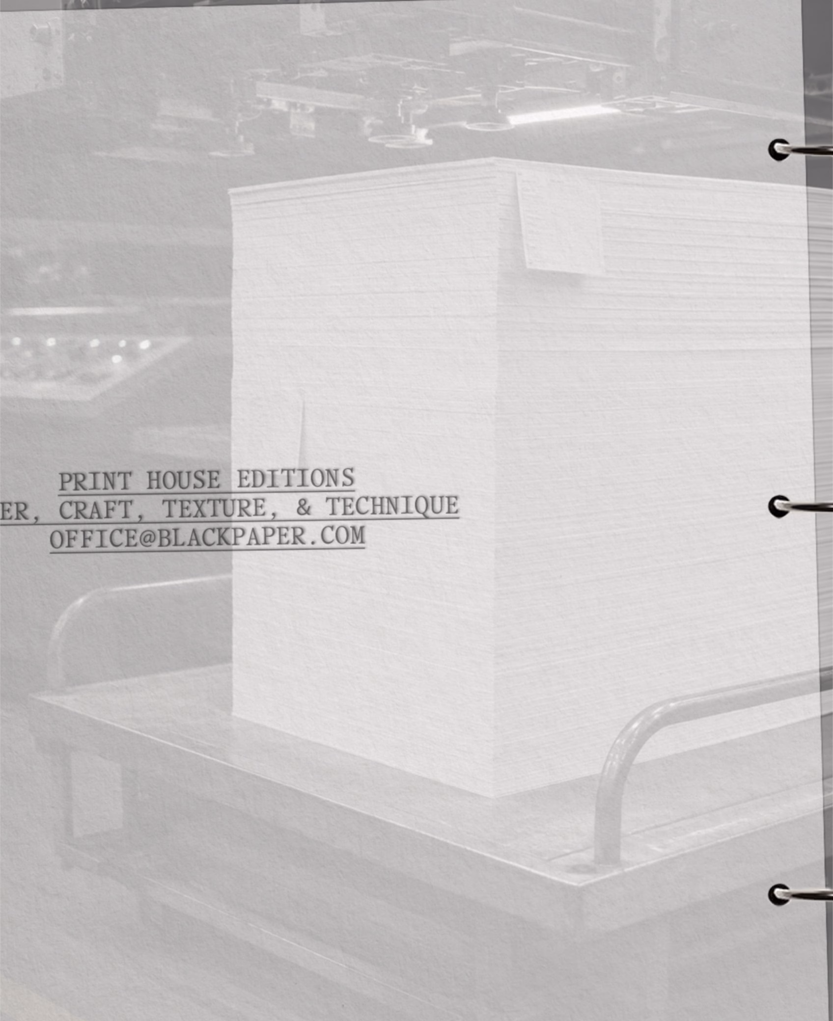 Stack of white sheets labelled Print House Editions on a trolley, Black Paper identity by DOMINGO.