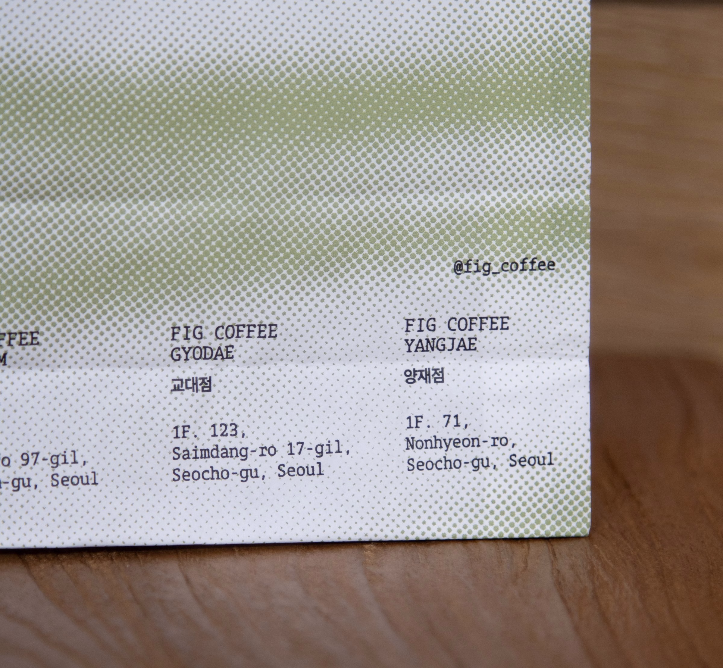 Fig Coffee's packaging features a green gradient dotted pattern with text listing locations and social media handle.