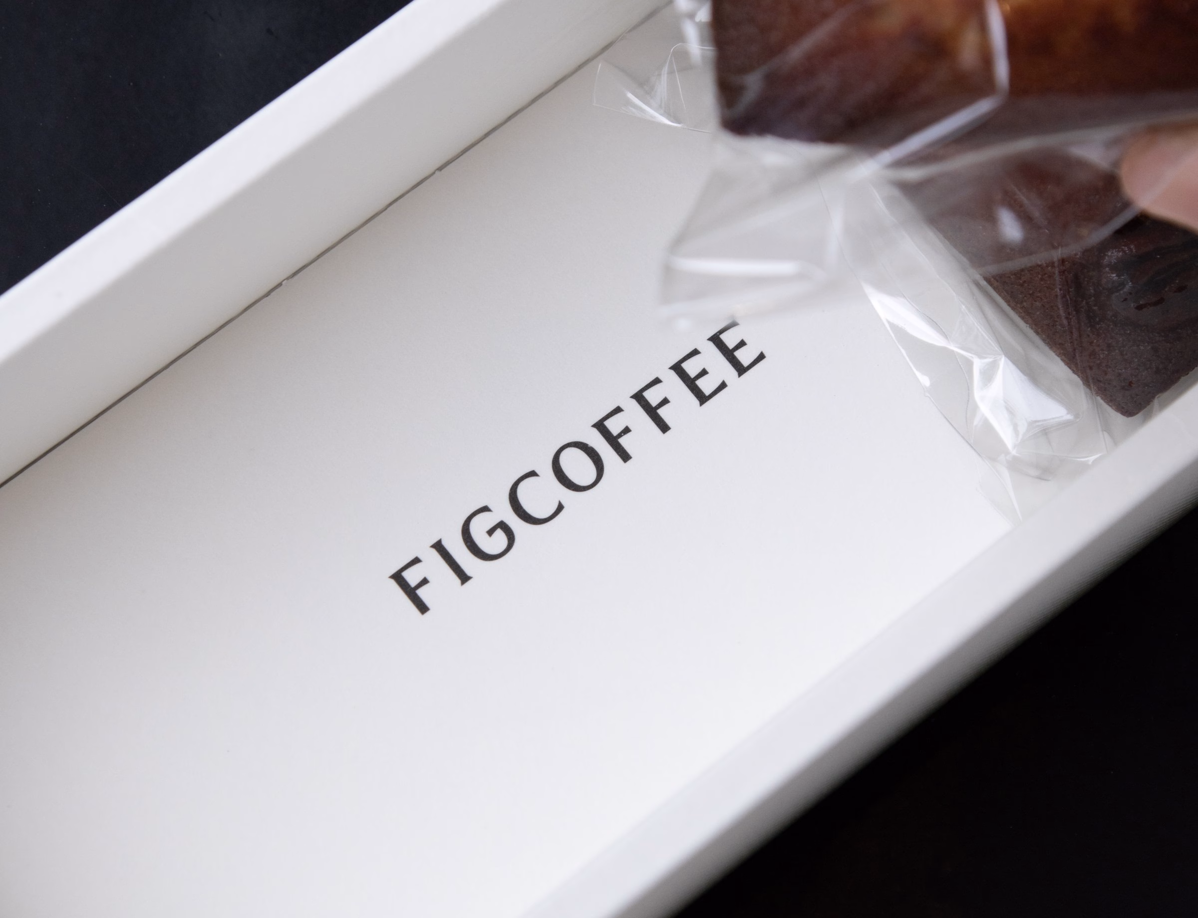 White Fig Coffee gift box opened to show a bag of coffee, packaging design